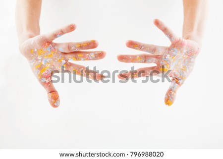 hands of artist dirty with tsuet paint, isolate on white background. place for text