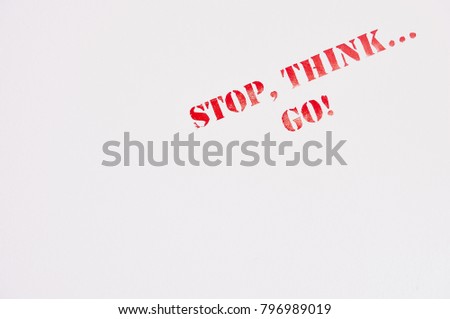 Safety sign saying "Stop, think...go" on the bulkhead of a ship near to exit to open deck
