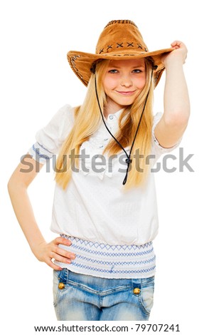 Sly blond girl wearing stetson hat, white chemise and jeans over isolated background