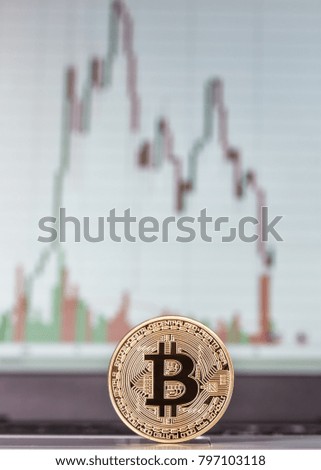 Coin Bitcoin close-up, and schedule the exchange in background.