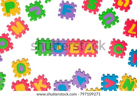 Foam puzzle letter uppercase with word Idea isolated on a white background.