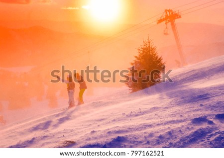 Couple have fun and take selfie in ski resort. Sport fun photo with edit space.