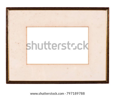 Empty picture frame isolated on white, landscape format with foxed mount, distressed gilt finish