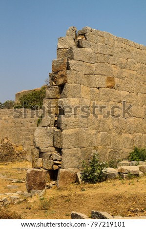 Old ruined ancient wall. Hampi, Karnataka, India