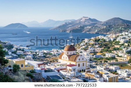 Beautiful mediterranean greek village Pantelis surrounded by a mountain with ancient castle located at the aegean sea with colorful houses and lovely churches basilicas, Leros, Dodecanese, Greece