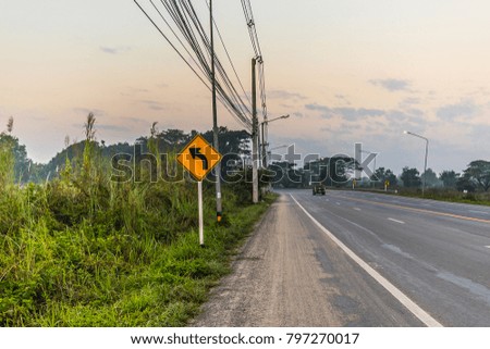Signboards on the road in morning sun. In Chiang Rai Thailand.