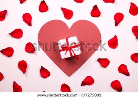 Romantic gesture, love confession, happy valentines day, anniversary greeting card, wedding invitation, birthday present. Red crimson rose petals spread on white background. Copy space, close up.