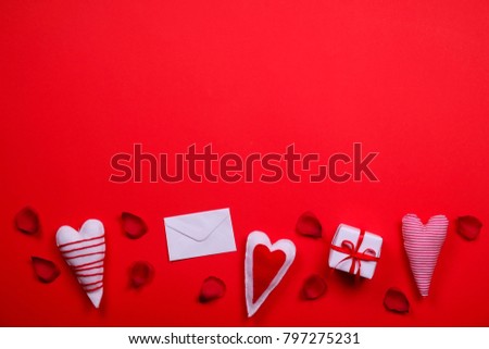 Romantic happy valentines day concept, love symbols, heart shapes on solid red paper background. Wedding invitation, greeting card envelope, holiday sale, discount. Top view, flat lay, copy text space