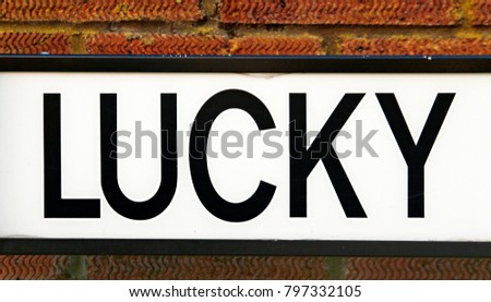 The word Lucky - a close up picture of an English road sign for Lucky Lane in Bristol UK.