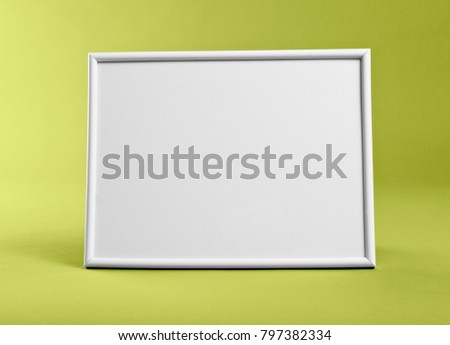 White frame for paintings or photographs on yellow background