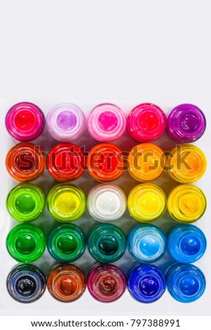 top view of color packed in clear bottles. Put together a rectangle on white background. Poster color for student range cheap price easy to paint for student. color are bold bright and opaque.
