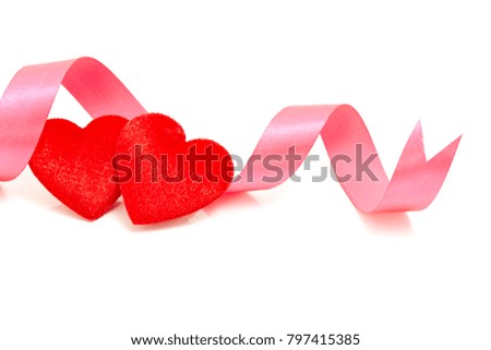 Two red hearts with pink ribbon isolated on white background