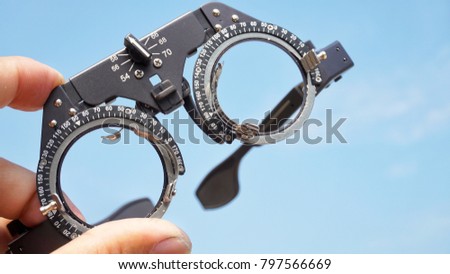 Optical eyeglass frames are the equipment of the ophthalmologist and blue background image.