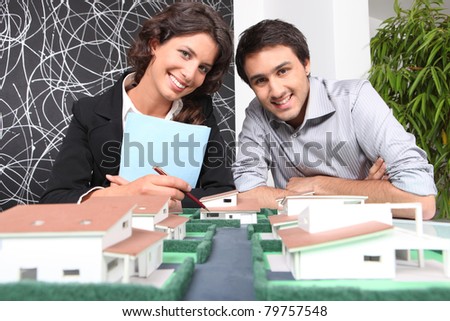 Agent and client looking at a new-build property model