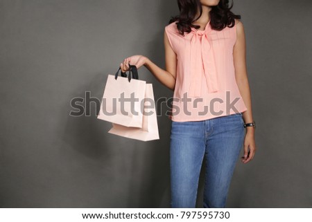 asian girl holding paper bag mock up