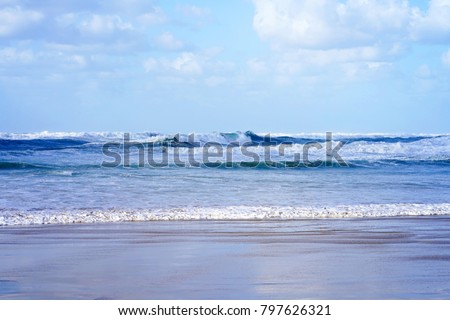 Beautiful wave on the beach. Early morning and strong wind. Cloudy morning.