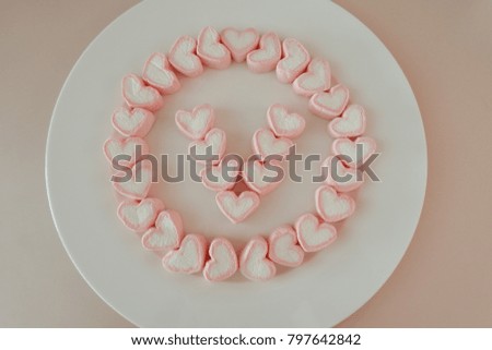 marshmallow isolated on white. pink heart pastel background. Valentine's day pink background.