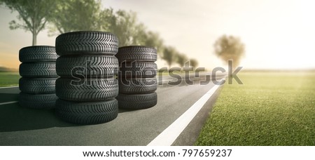 Summer tires on a country road Royalty-Free Stock Photo #797659237
