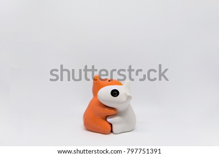 Hugging ceramic dogs couple in the middle of the picture