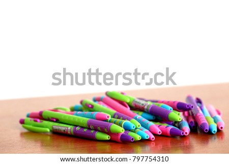 Colored pens on wooden boards selective focus and shallow depth of field