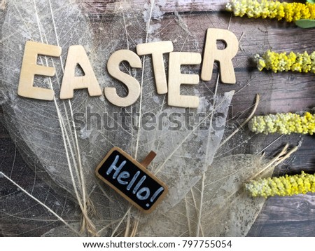easter. rustic easter wooden letters with chalkboard on woodeb backgrund. 