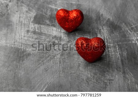 Red hearts on a dark background. Copy space. Food background