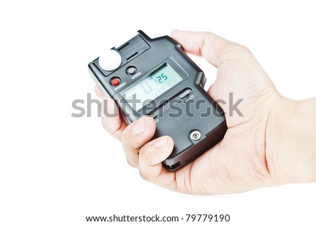 hand holding light meter isolated on white background