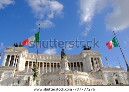 Italian flag fluttering against the Altar of the Fatherland from Piazza Venezia, Rome, Italy