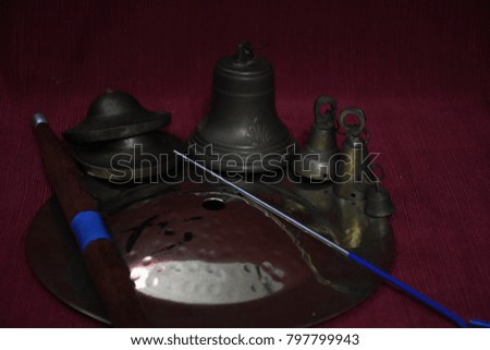 Percussion instruments. Metal Stick and bells in a dark atmosphere