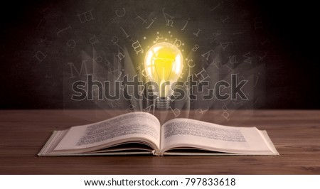 Shiny alphabet letters and yellow lightbulb hovering over open book 