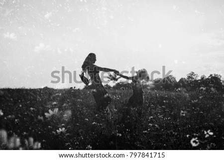 Girls in the field of flowers, double exposure