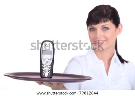 Waitress with a cell phone on a tray