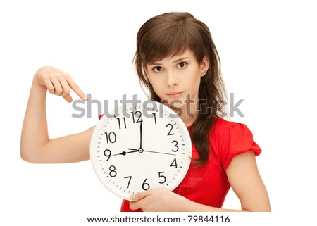 bright picture of teenage girl holding big clock