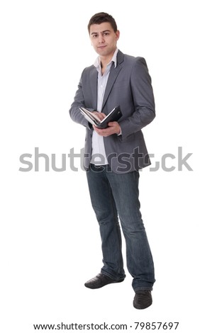 Man makes a note in notebook.
