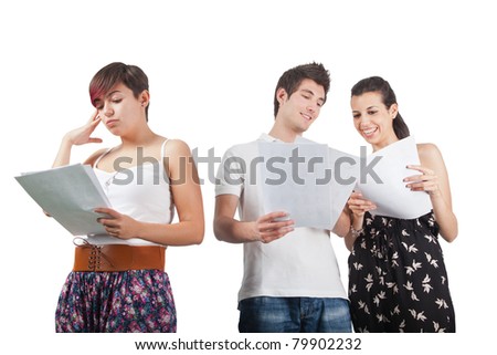 a man and two women studying some papers