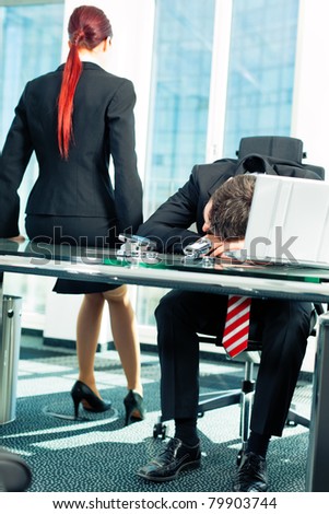 Business - nap in the office to relieve stress Royalty-Free Stock Photo #79903744