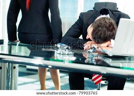 Business - nap in the office to relieve stress Royalty-Free Stock Photo #79903765