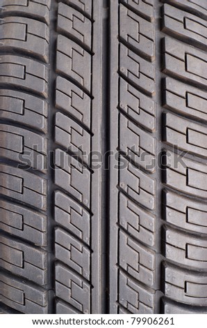 Part of rubber black summer car tire closeup