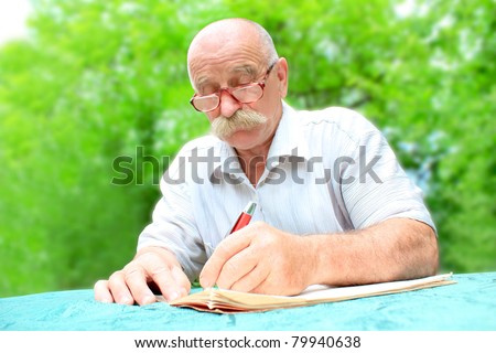 man writes papers