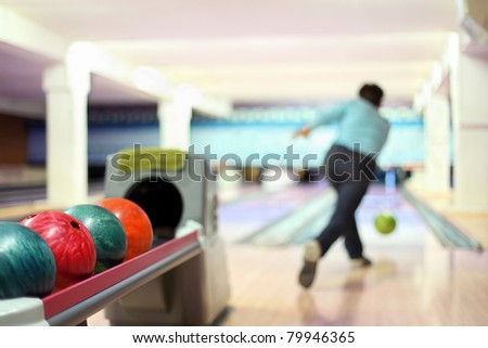 Man in club for bowling throw ball
