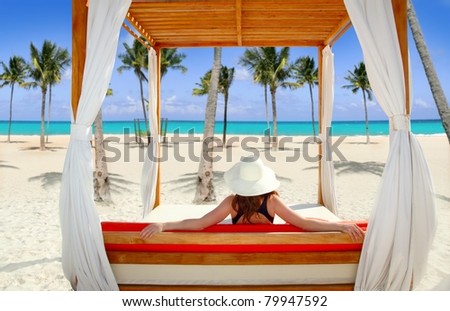gazebo tropical beach with woman rear view looking sea from a tropical resort [Photo Illustration]