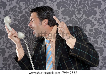businessman shouting angry expression and rude finger talking by  telephone with retro mustache