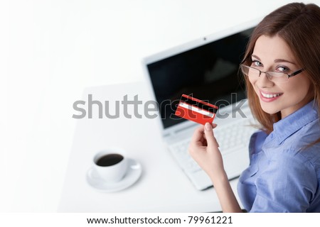 Young girl with laptop and credit card