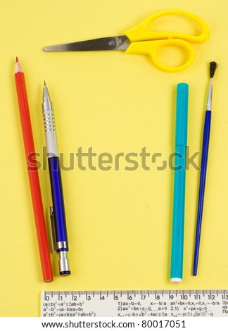 school accessories on yellow background
