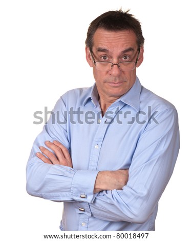 Surprised Middle Age Man in Blue Shirt with Arms Folded Looking Over Glasses Royalty-Free Stock Photo #80018497