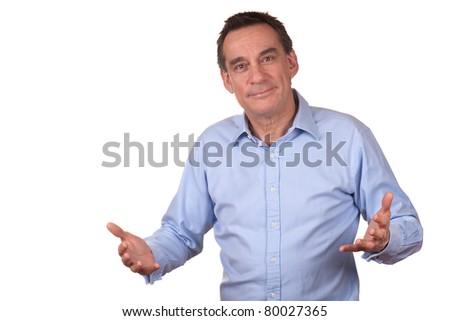 Attractive Smiling Middle Age Man in Blue Shirt with Raised Hands as though Talking Royalty-Free Stock Photo #80027365