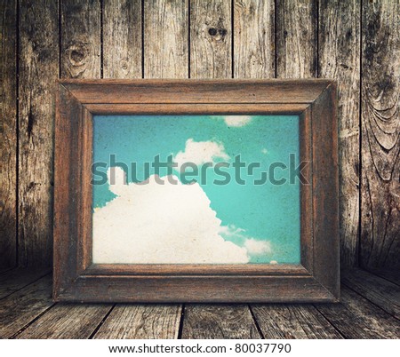Old vintage frame in wooden room