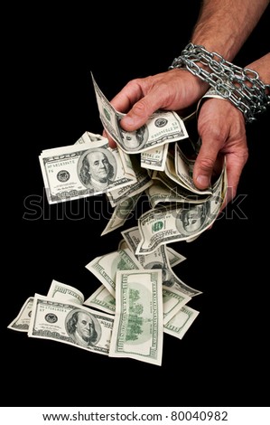 Hands with dollars in chain on a black background