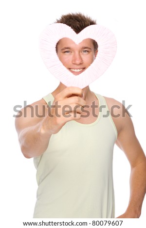 Full isolated portrait of a  smiling young man with pink heart