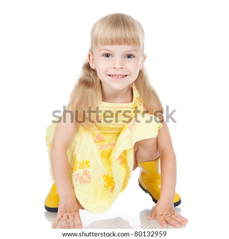 Picture of happy little girl in the yellow boots over white